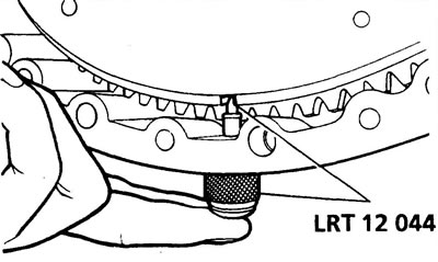 Automatic Transmission: Locate the torque converter clutch access cover at the rear of the engine…