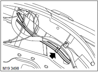 7. Disconnect the filler pipe hose and the fuel vapor canister hose from the mounting bracket on…