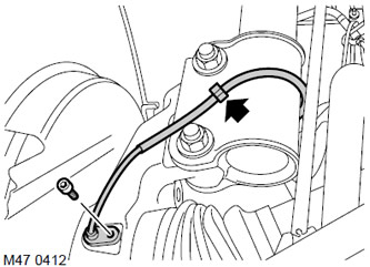 6. Освободете окабеляването на сензора за скорост на колелото от скобата.